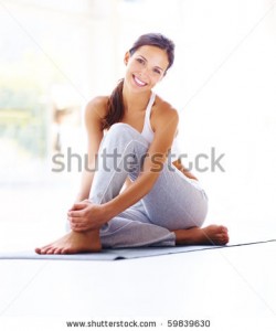 stock-photo-portrait-of-beautiful-young-woman-relaxing-after-doing-exercise-59839630