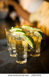 stock-photo-row-of-tequila-shots-with-limes-33623005